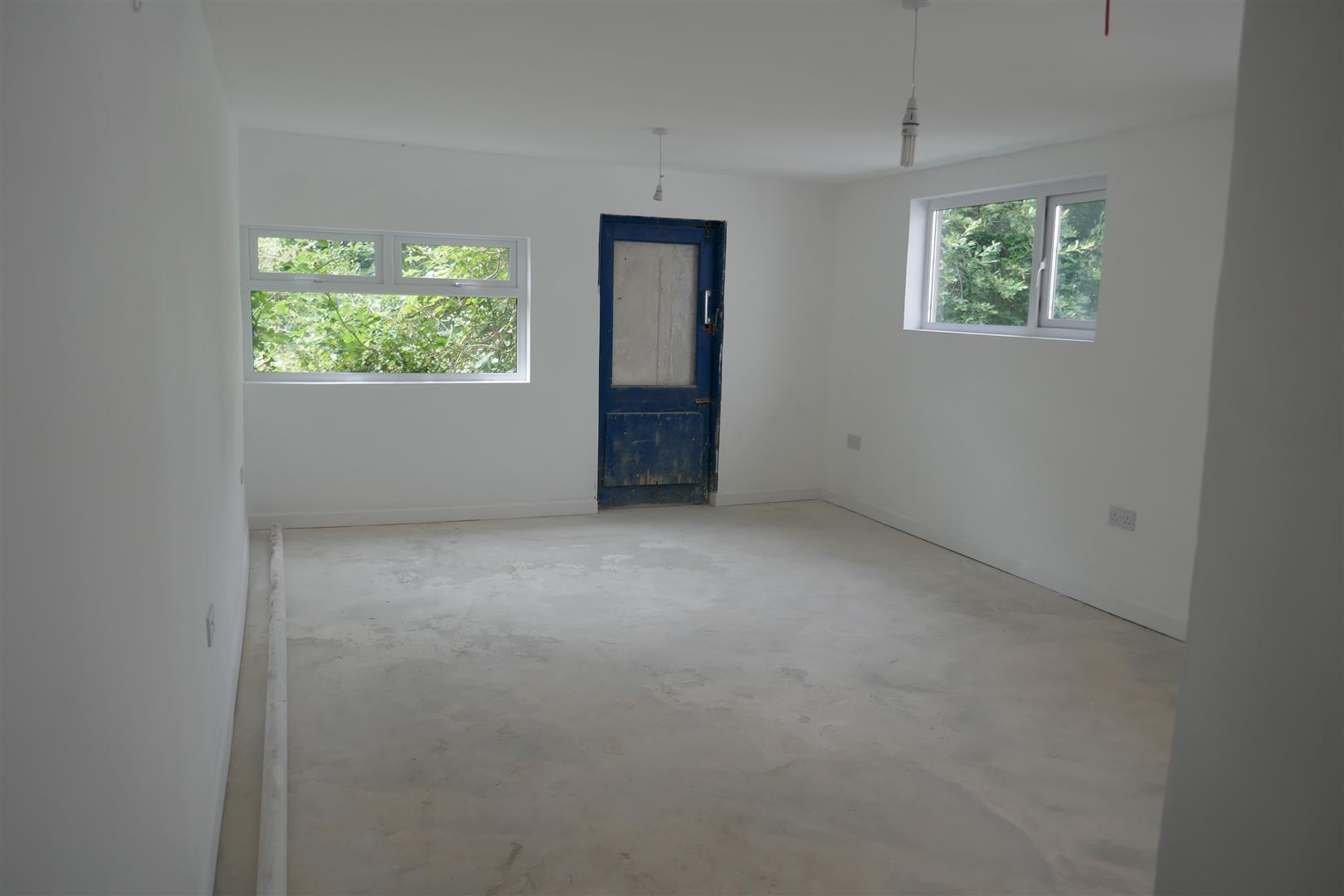 REAR OFFICE/LIVING ROOM